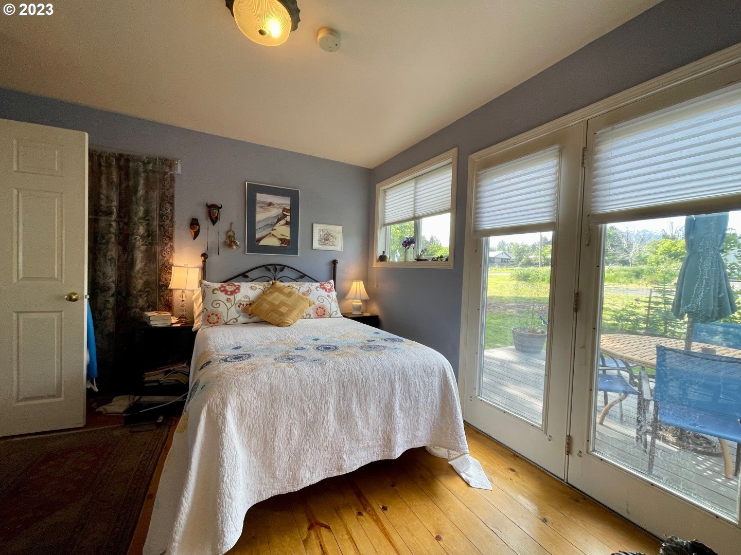 809 South Lake Street Joseph, OR 97846 - Photo 15 of 38 a bedroom with a bed and wooden floor