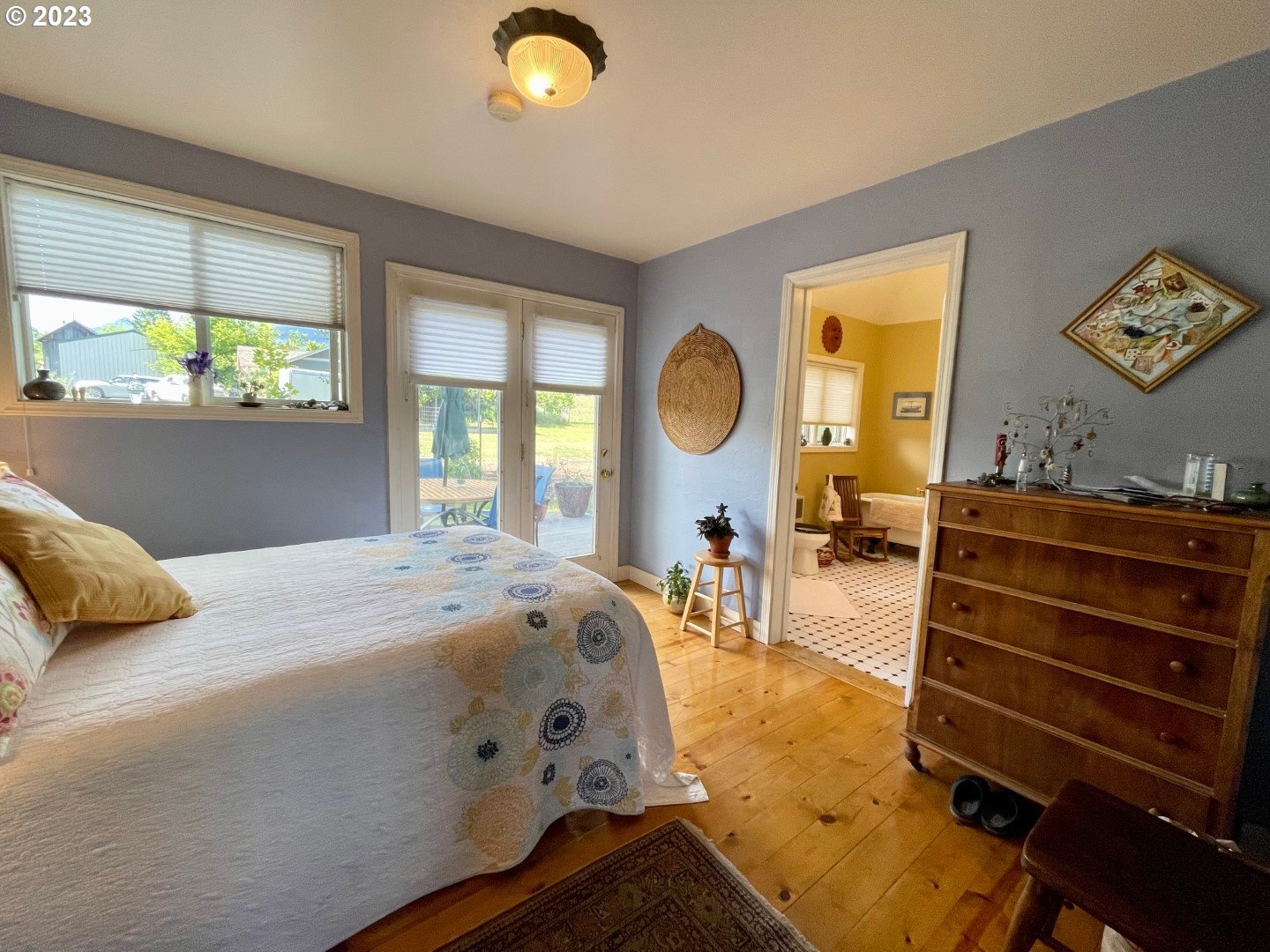 809 South Lake Street Joseph, OR 97846 - Photo 16 of 38 a bed sitting in a bedroom next to a window