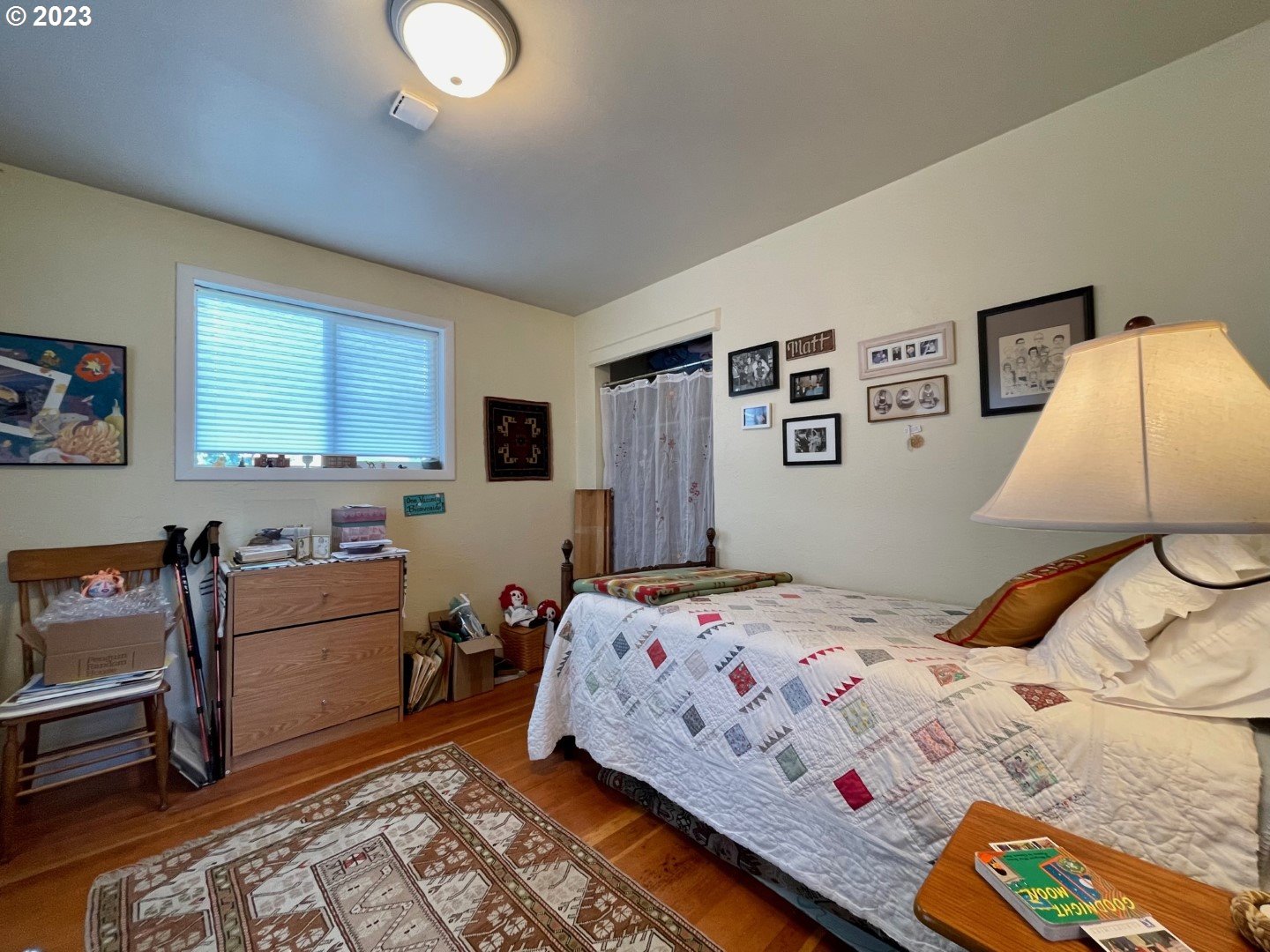 809 South Lake Street Joseph, OR 97846 - Photo 19 of 38 a bedroom with a bed and wooden floor