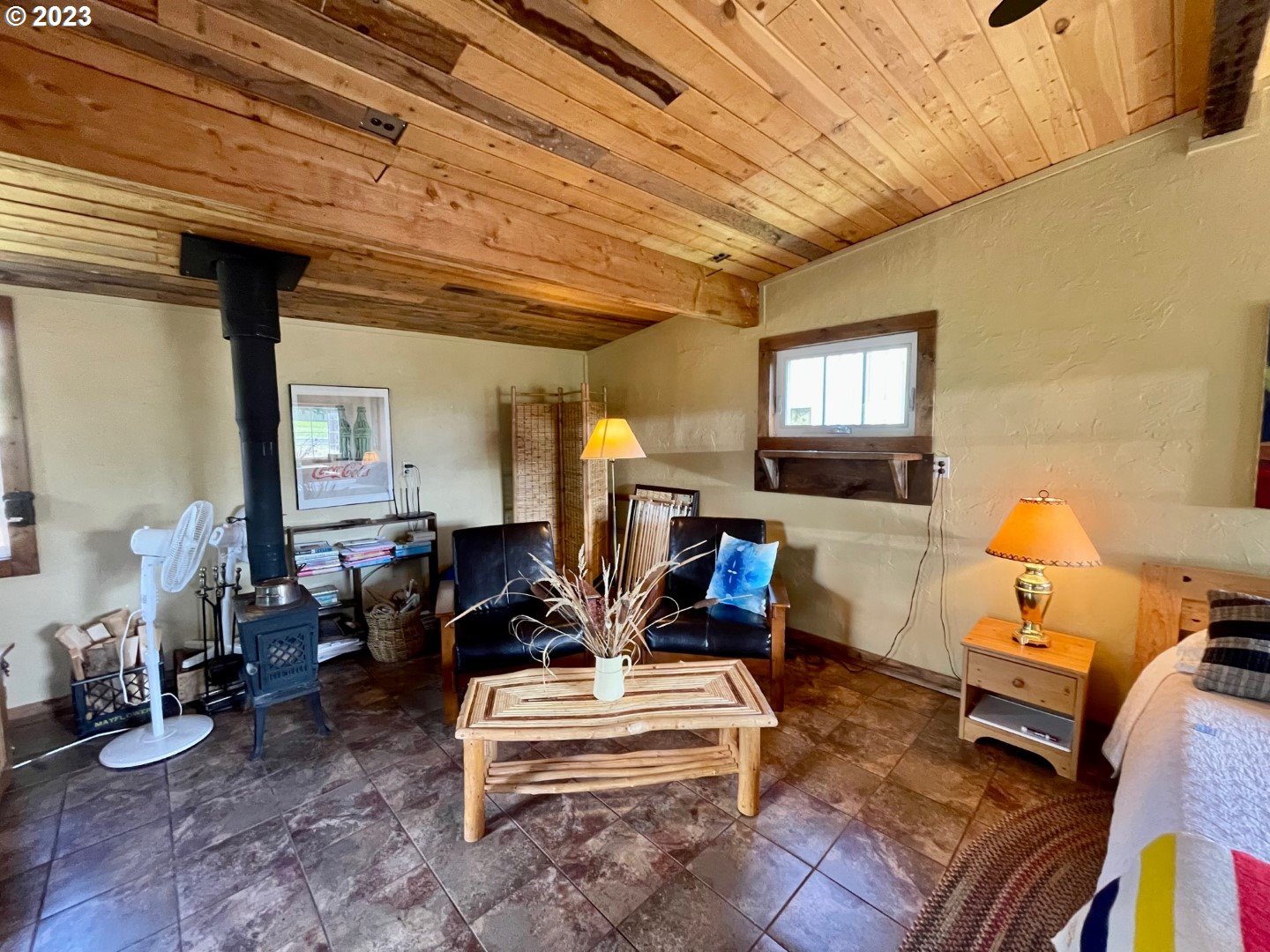 809 South Lake Street Joseph, OR 97846 - Photo 24 of 38 a living room with furniture a flat screen tv and a table