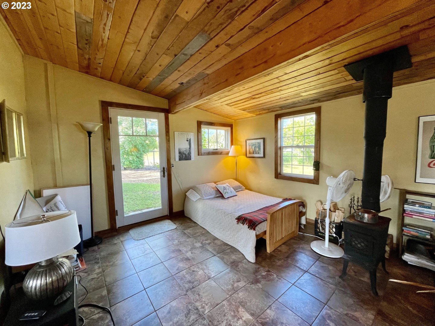 809 South Lake Street Joseph, OR 97846 - Photo 25 of 38 a living room with furniture a flat screen tv and a window