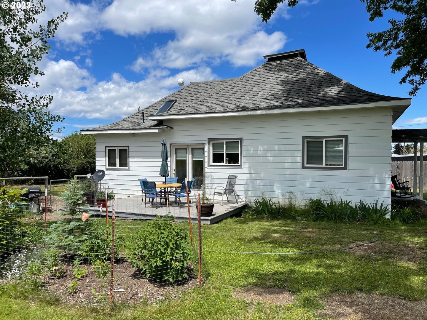 809 South Lake Street Joseph, OR 97846 - Photo 28 of 38 a view of a house with backyard sitting area and garden