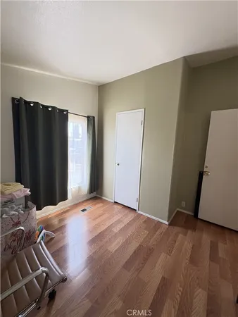 a view of a livingroom with wooden floor