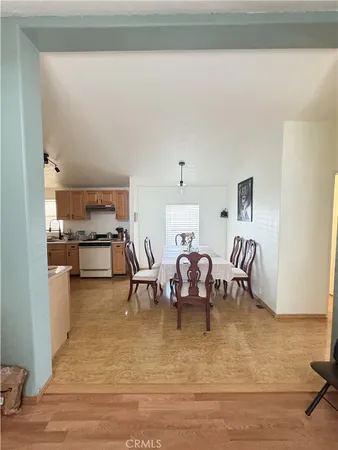 a living room with fireplace furniture and a rug