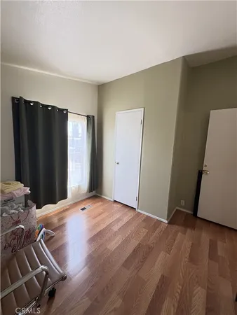 a view of a livingroom with wooden floor