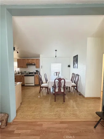 a living room with fireplace furniture and a rug