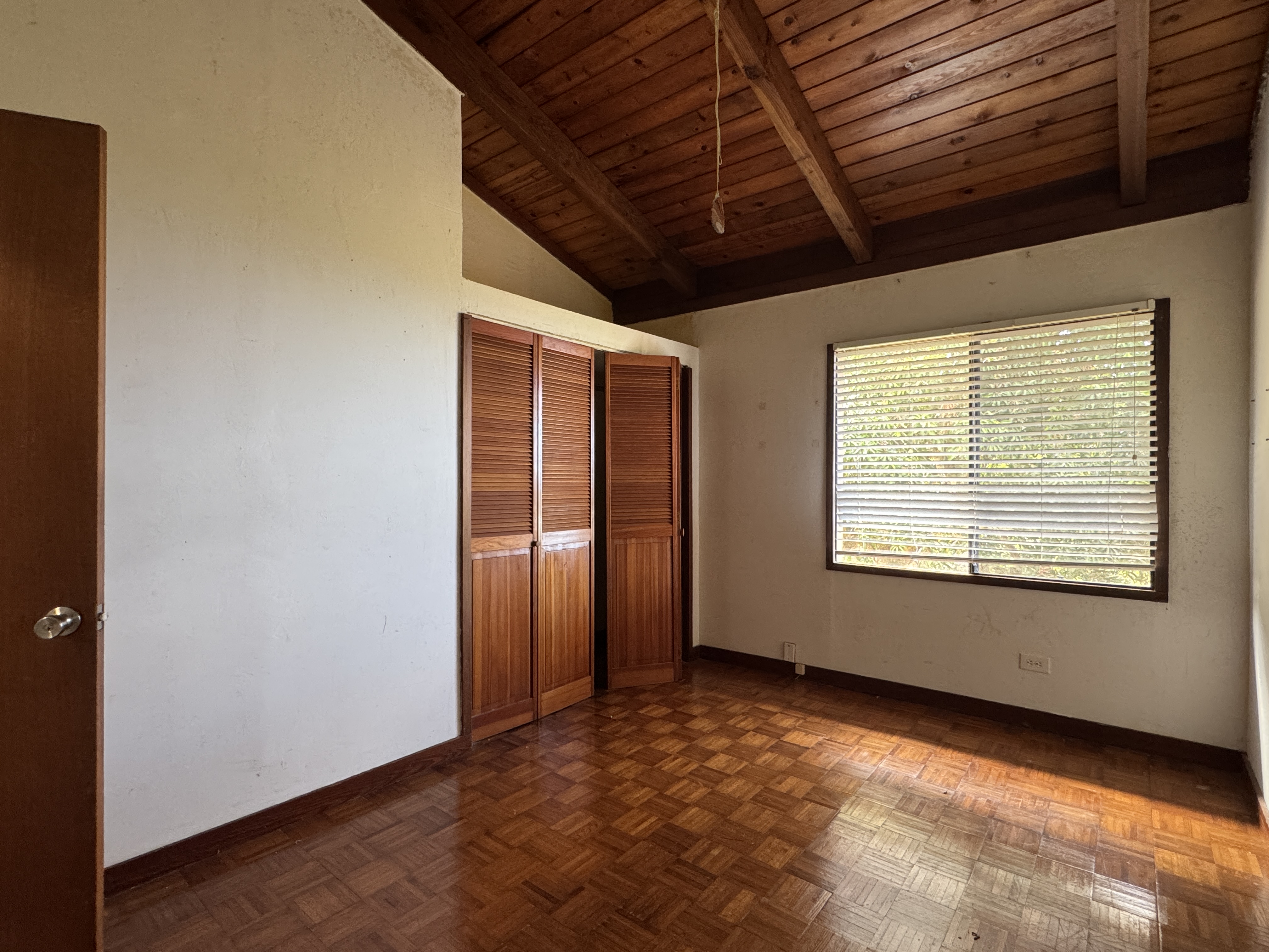 84-5040 Hawaiʻi Belt Road Captain Cook, HI 96704 - Photo 13 of 30 an empty room with windows