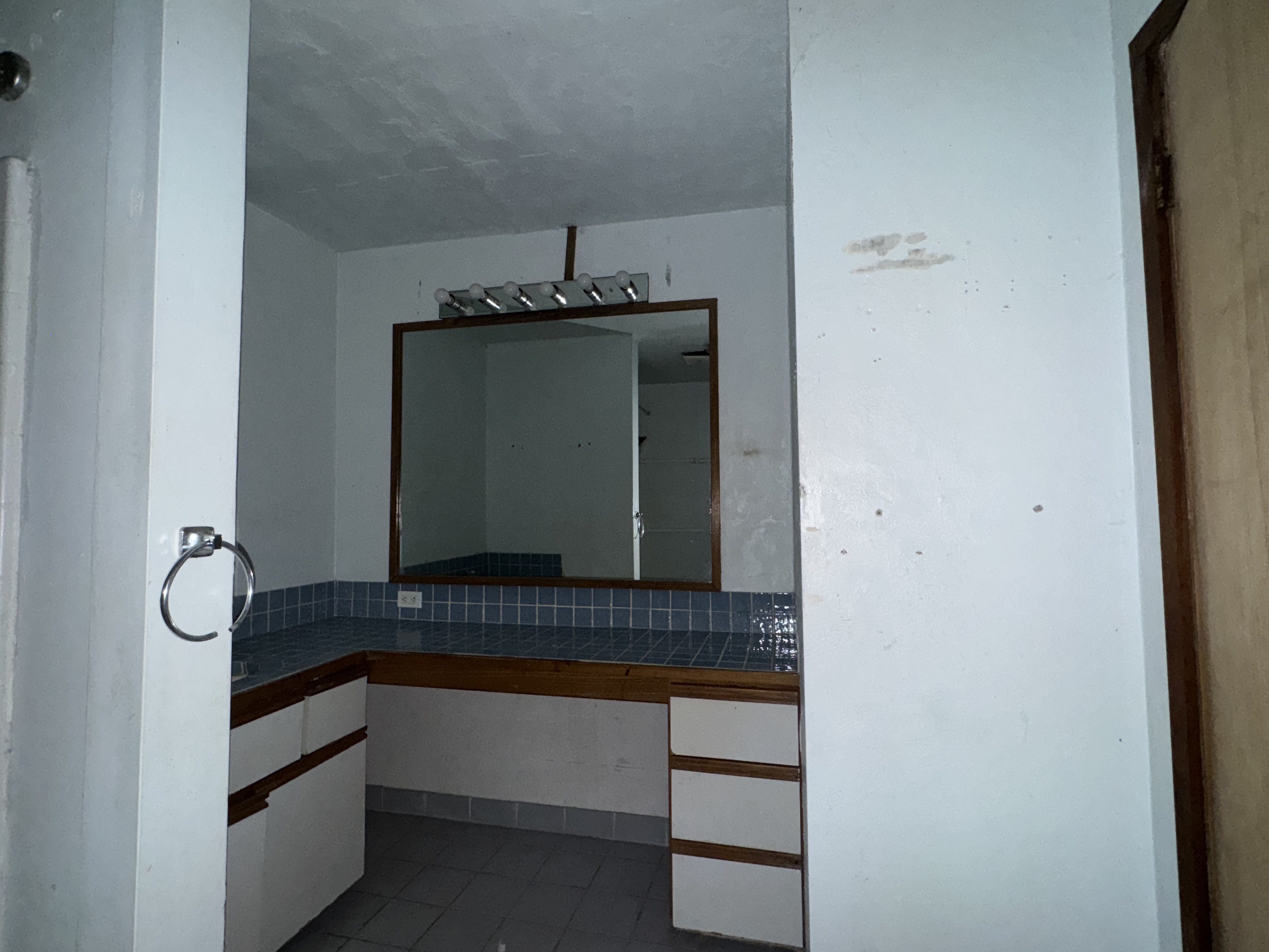 84-5040 Hawaiʻi Belt Road Captain Cook, HI 96704 - Photo 15 of 30 a bathroom with a sink and a mirror