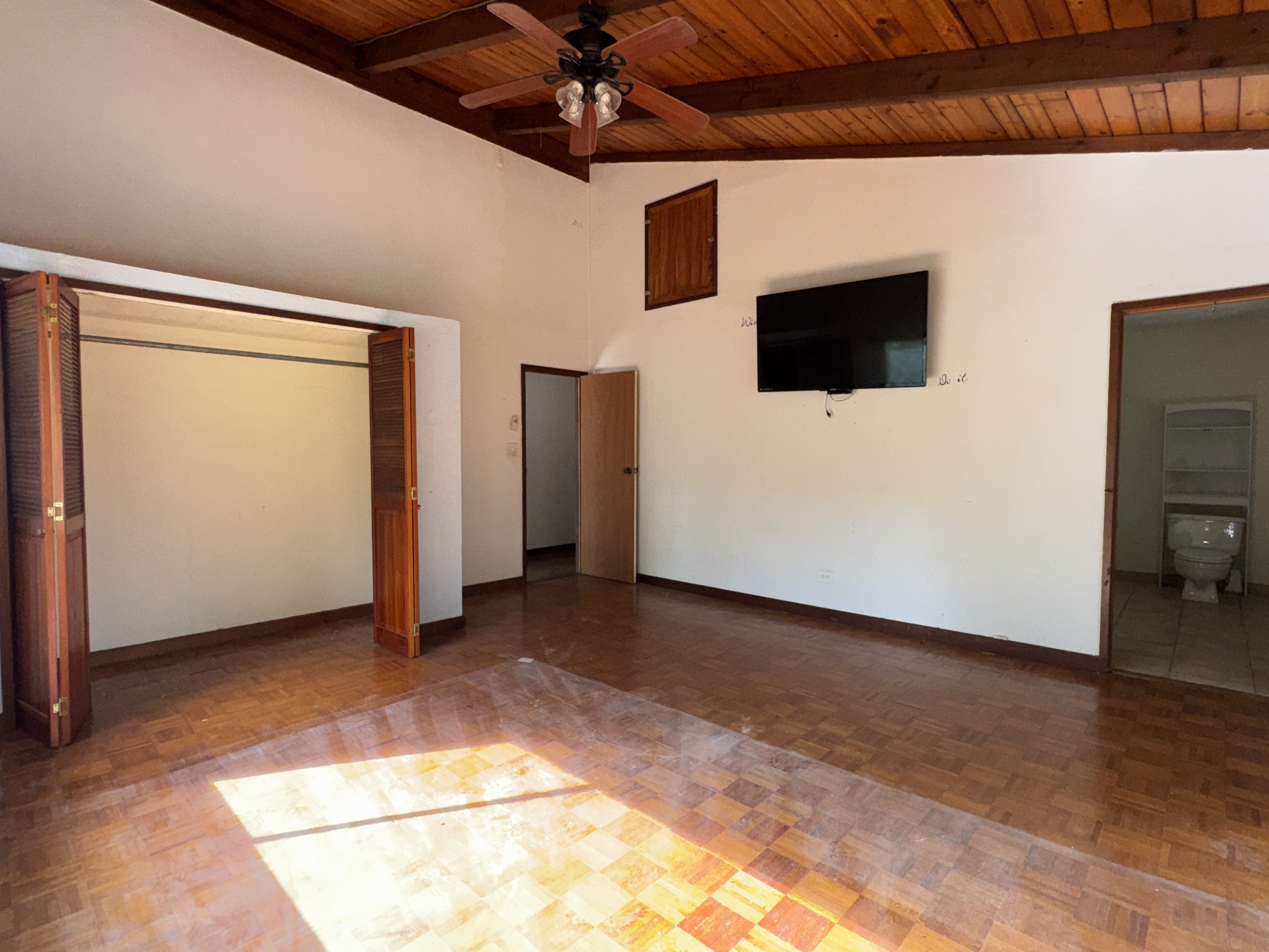 84-5040 Hawaiʻi Belt Road Captain Cook, HI 96704 - Photo 20 of 30 a view of a livingroom with wooden floor