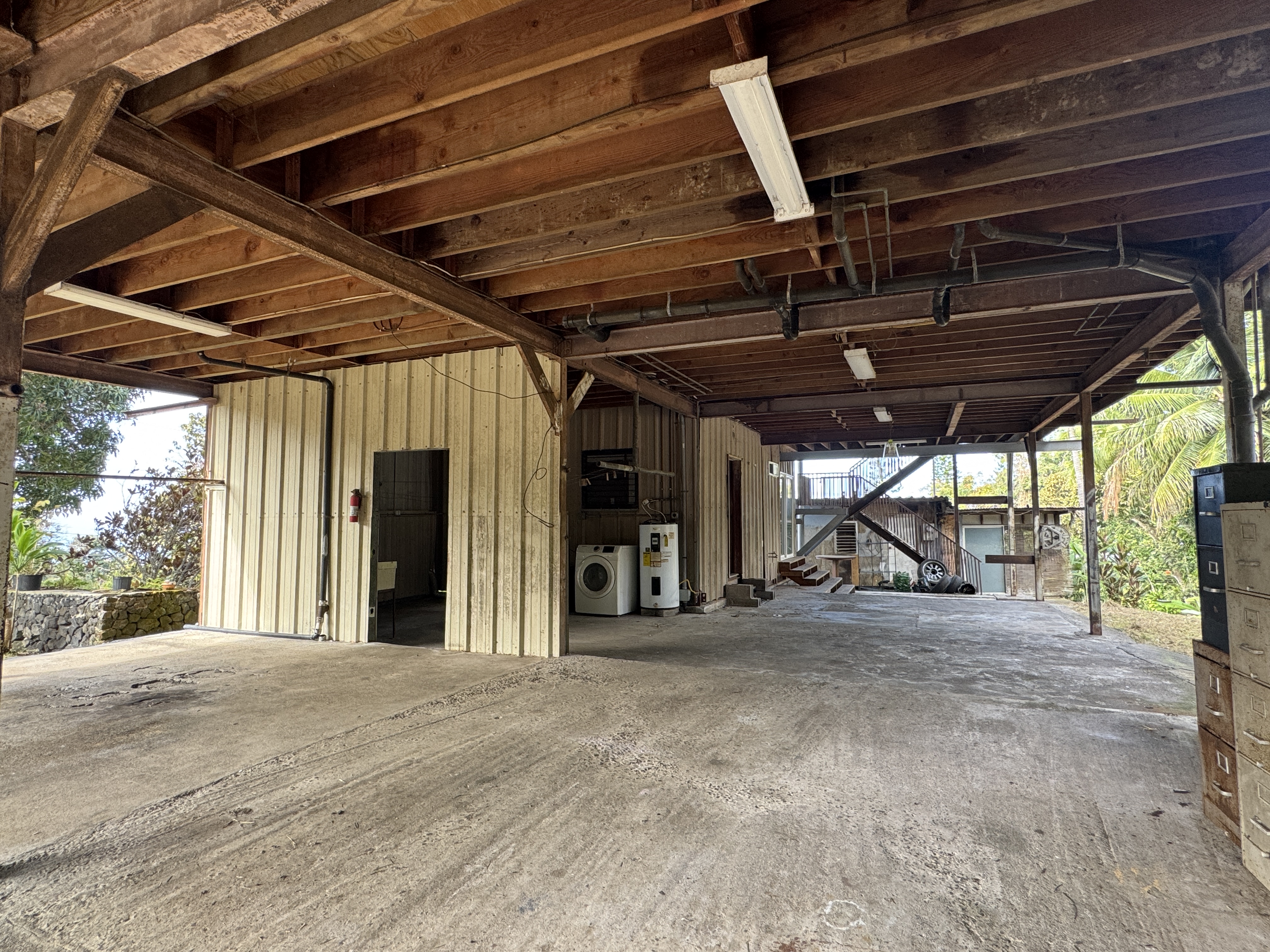 84-5040 Hawaiʻi Belt Road Captain Cook, HI 96704 - Photo 23 of 30 a view of a room with wooden walls