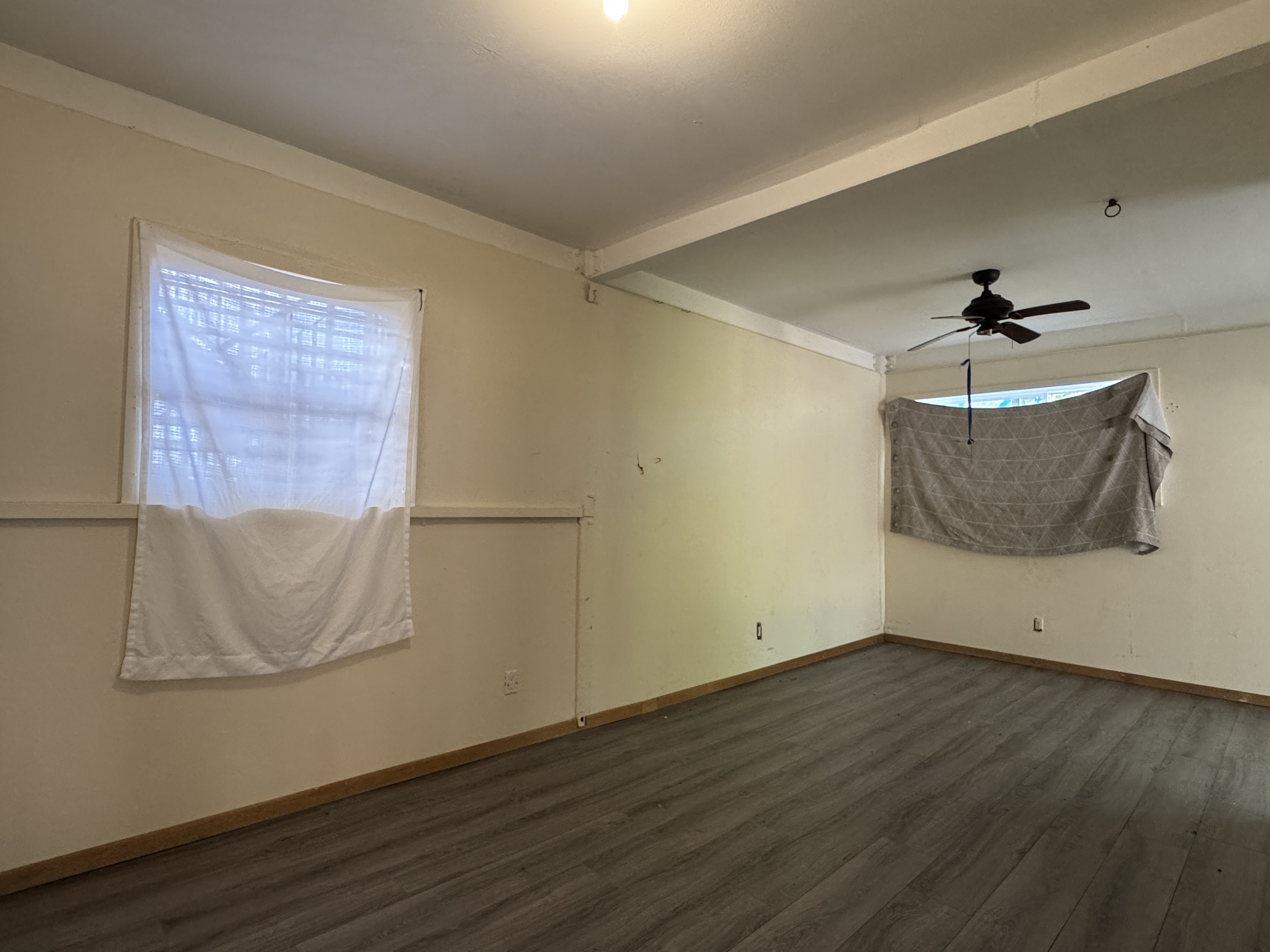 84-5040 Hawaiʻi Belt Road Captain Cook, HI 96704 - Photo 24 of 30 a view of a room with wooden floor and cabinet