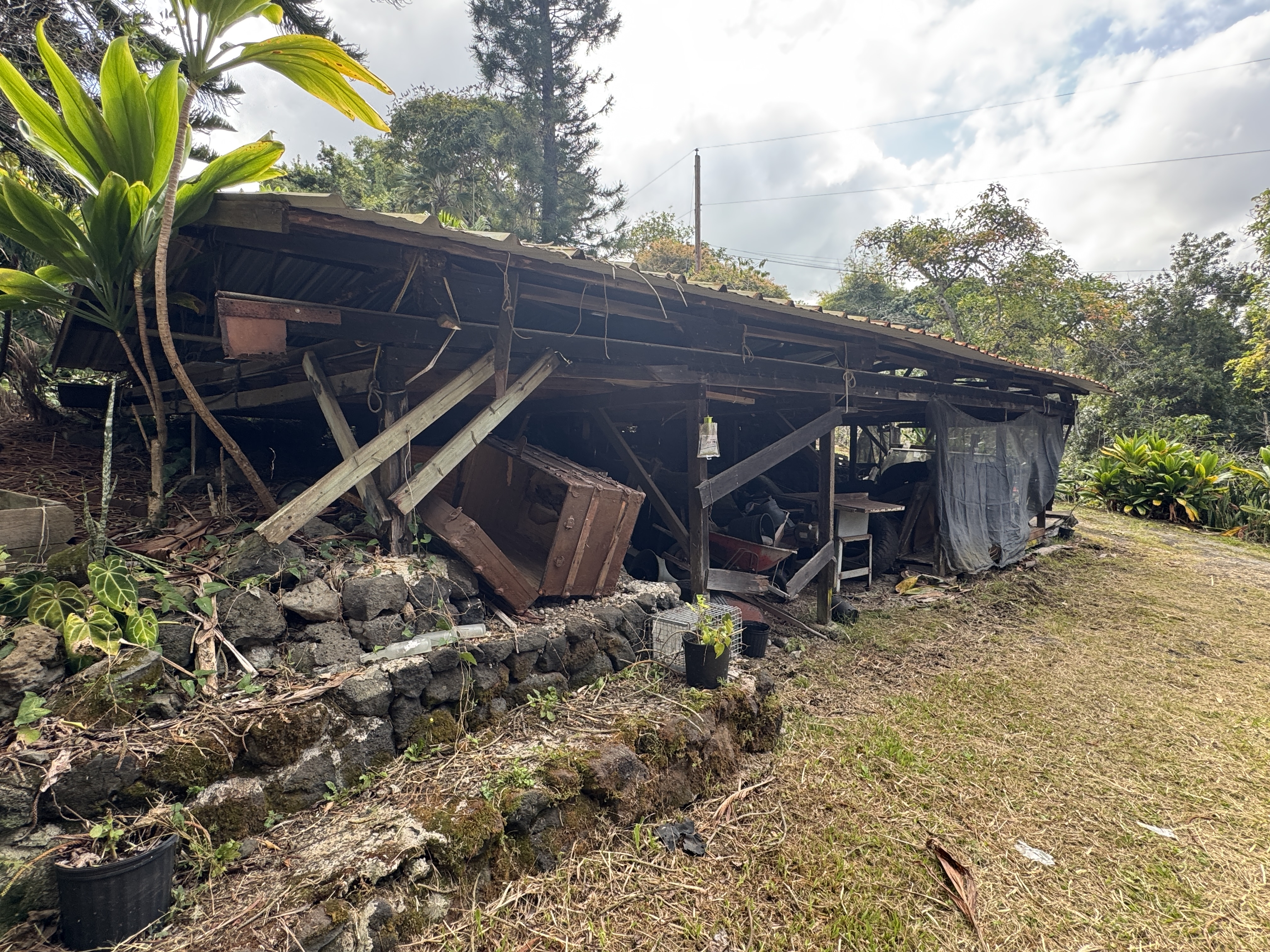 84-5040 Hawaiʻi Belt Road Captain Cook, HI 96704 - Photo 26 of 30 a view of house with backyard and entertaining space