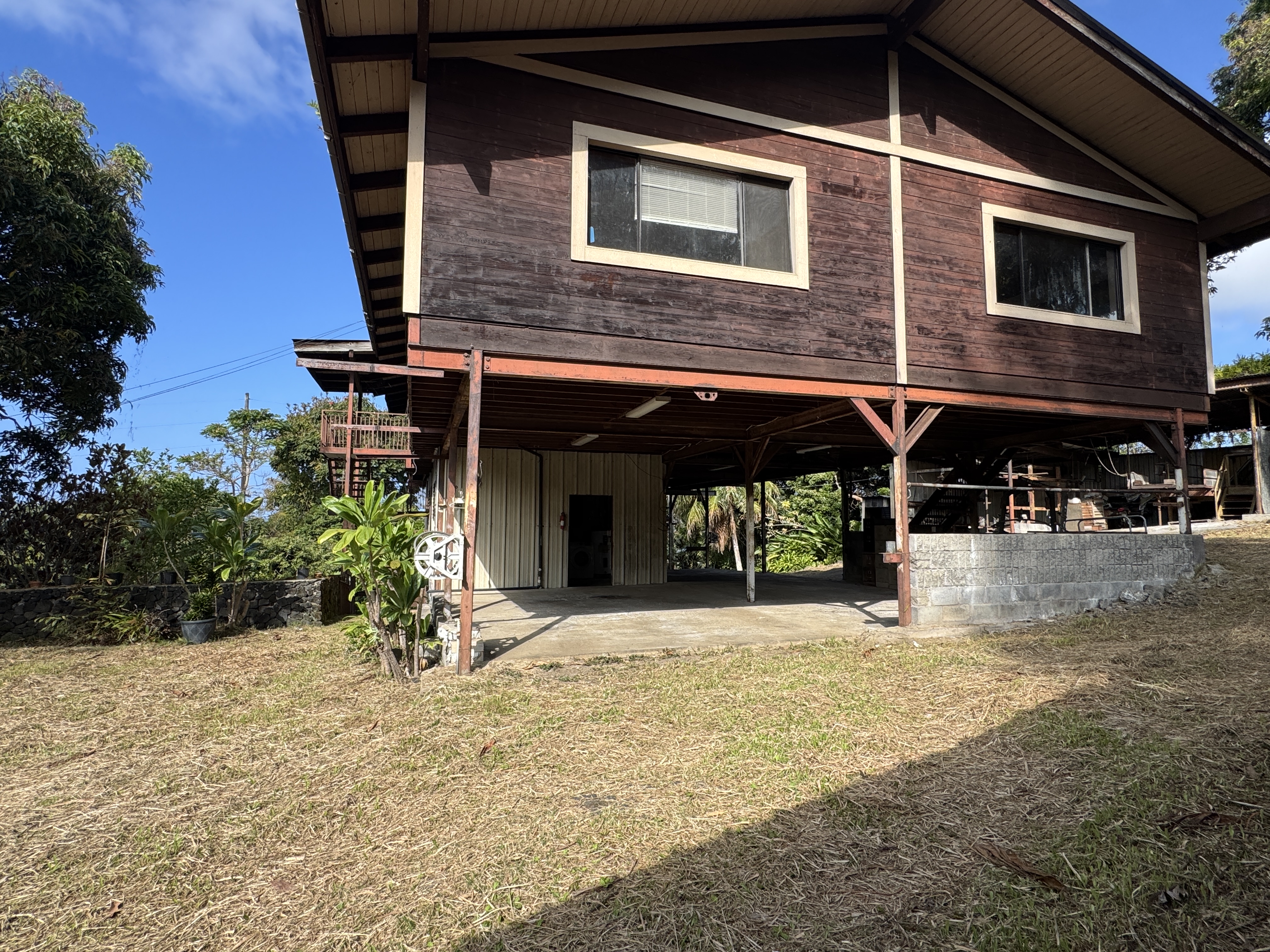 84-5040 Hawaiʻi Belt Road Captain Cook, HI 96704 - Photo 3 of 30 a view of a house with a patio