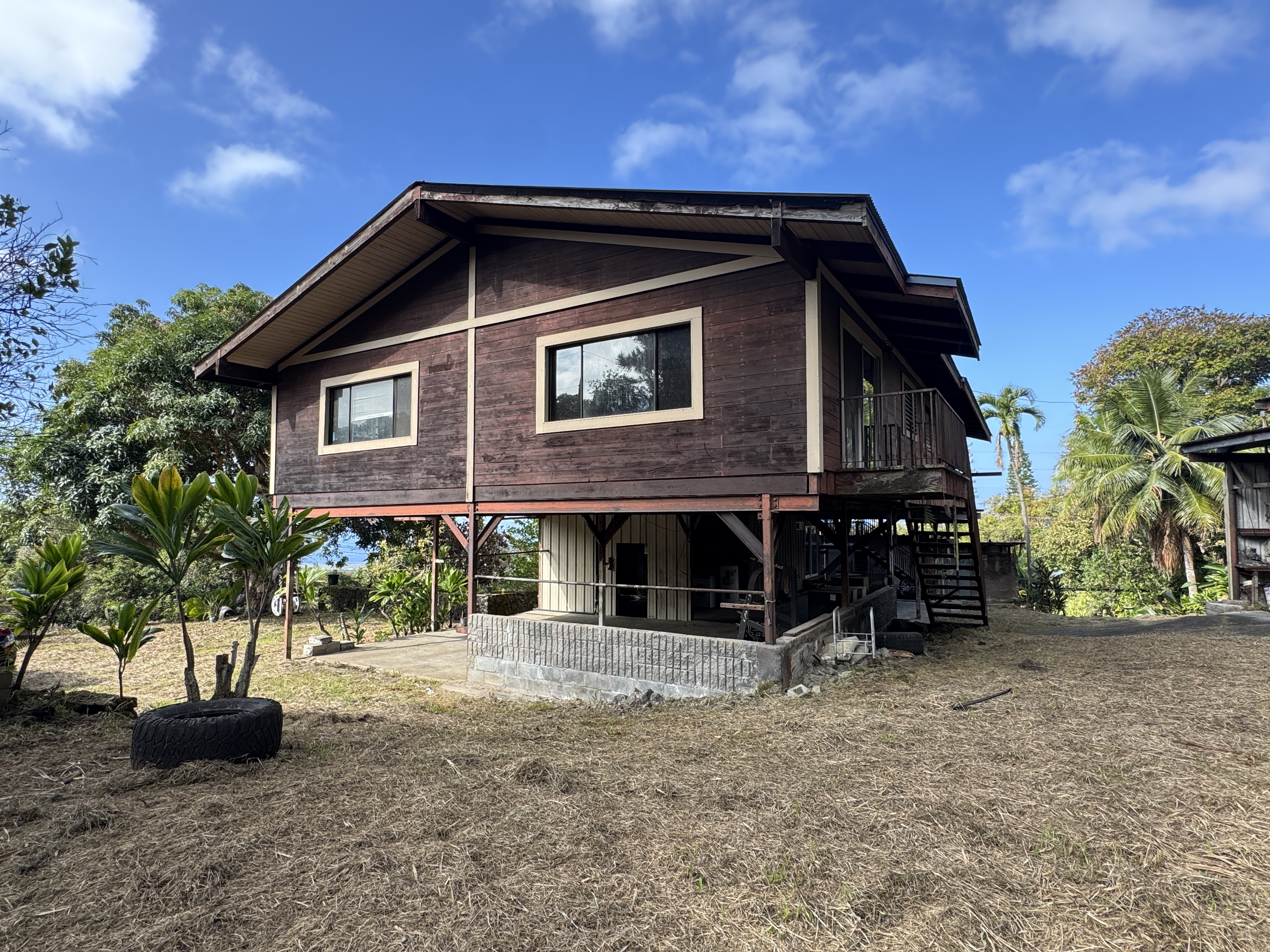 84-5040 Hawaiʻi Belt Road Captain Cook, HI 96704 - Photo 4 of 30 a view of a house with a yard