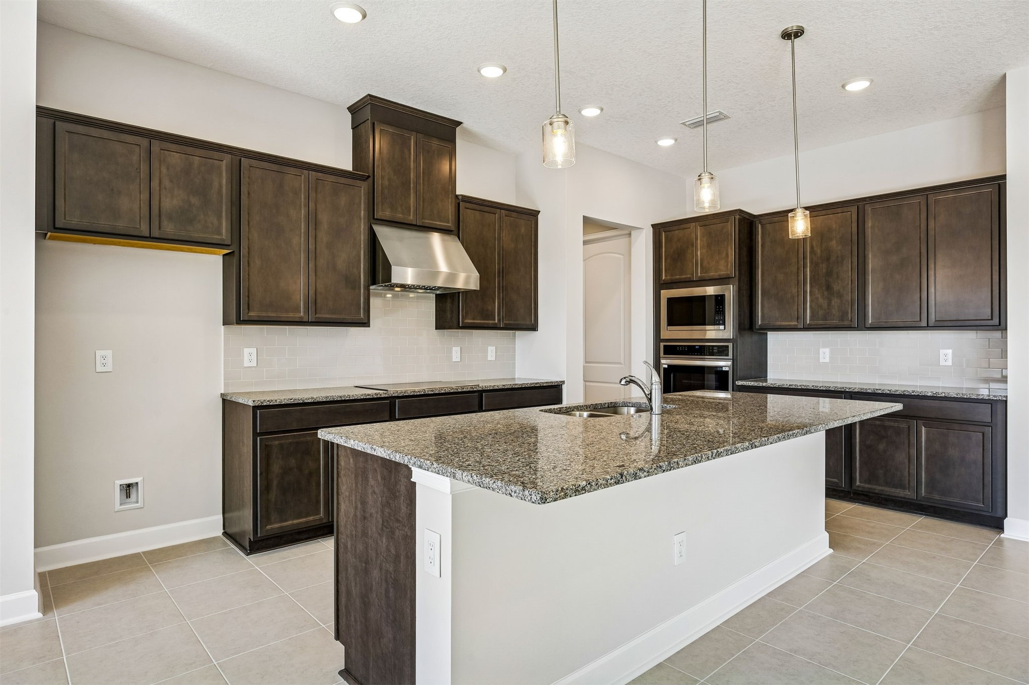 85417 Sandy Rdg Loop Yulee, FL 32097 - Photo 10 of 21 a kitchen with stainless steel appliances granite countertop a sink a stove and a refrigerator