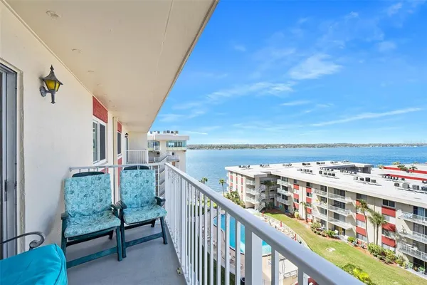 a view of a balcony with an ocean
