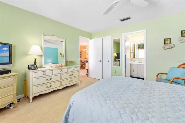 a bedroom with a bed and a dresser