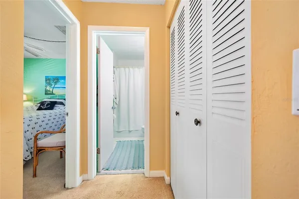 a bedroom with a bed and with furniture