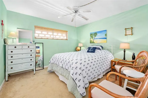 a bedroom with a bed and a table