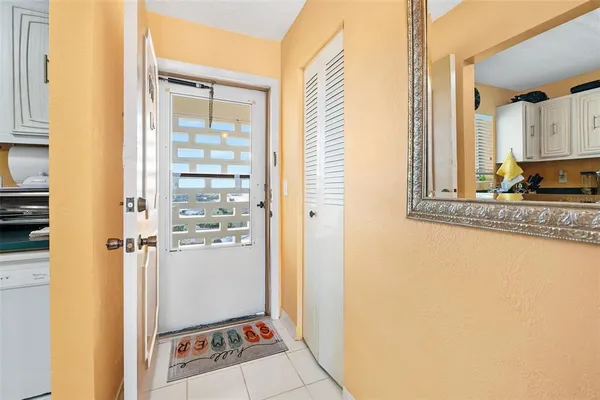 a view of a bathroom with a sink and a mirror