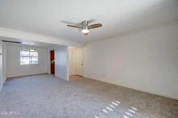 a kitchen with granite countertop cabinets sink and window