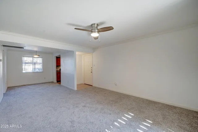 a kitchen with granite countertop cabinets sink and window