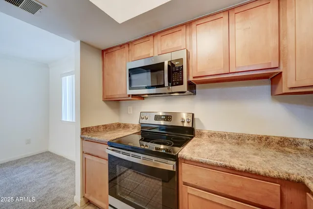 a white refrigerator freezer sitting inside of a kitchen