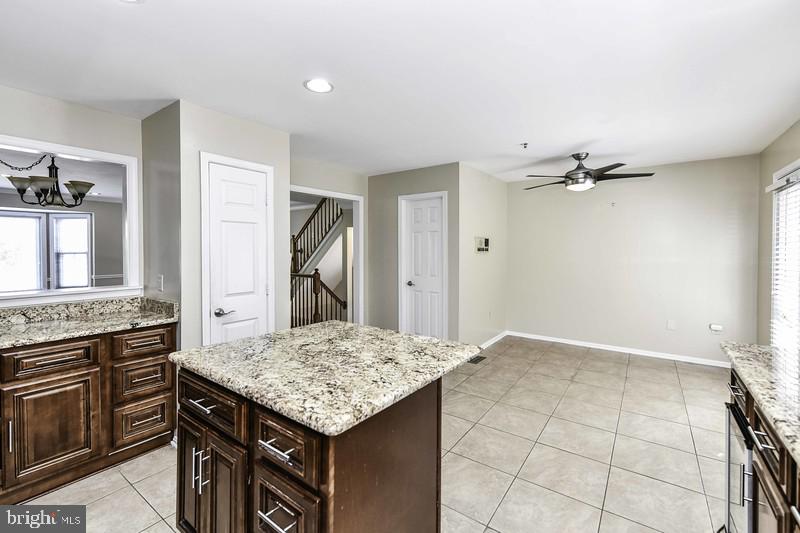 2 Parker Farm Court Silver Spring, MD 20906 - Photo 22 of 34 a kitchen with a stove and a refrigerator