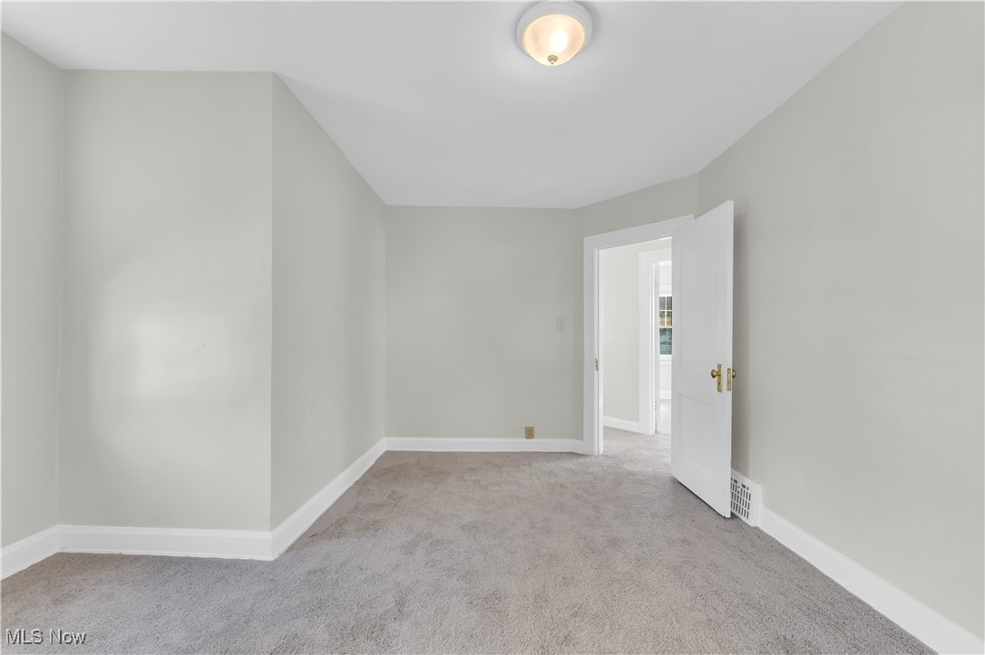 945 Nela View Road Cleveland Heights, OH 44112 - Photo 16 of 27 Unfurnished room with light carpet and baseboards