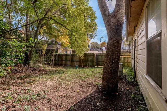 a backyard of a house with lots of green space