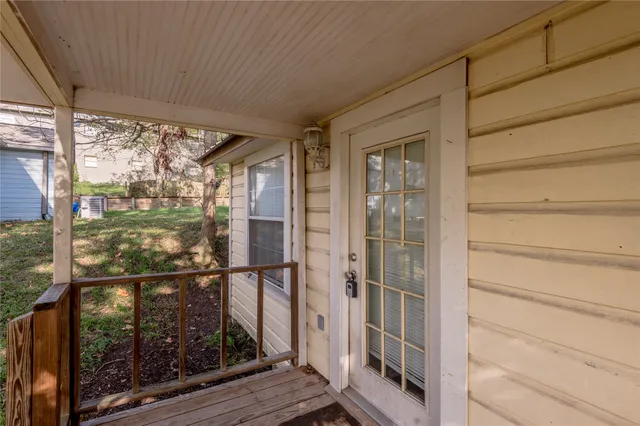 a view of a balcony with wooden floor