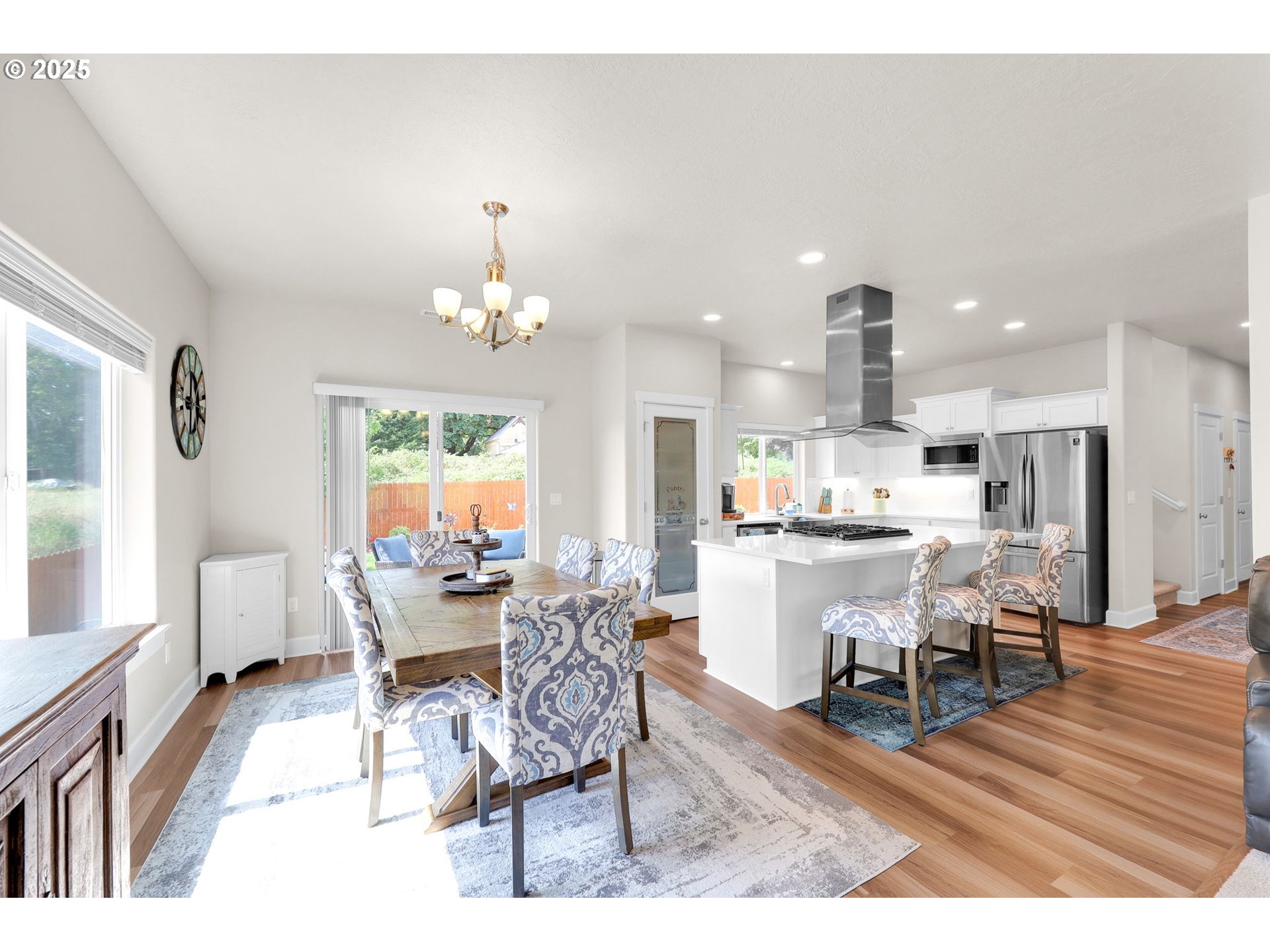 580 South 10th Street Monroe, OR 97456 - Photo 11 of 45 a dining room with furniture a chandelier and wooden floor