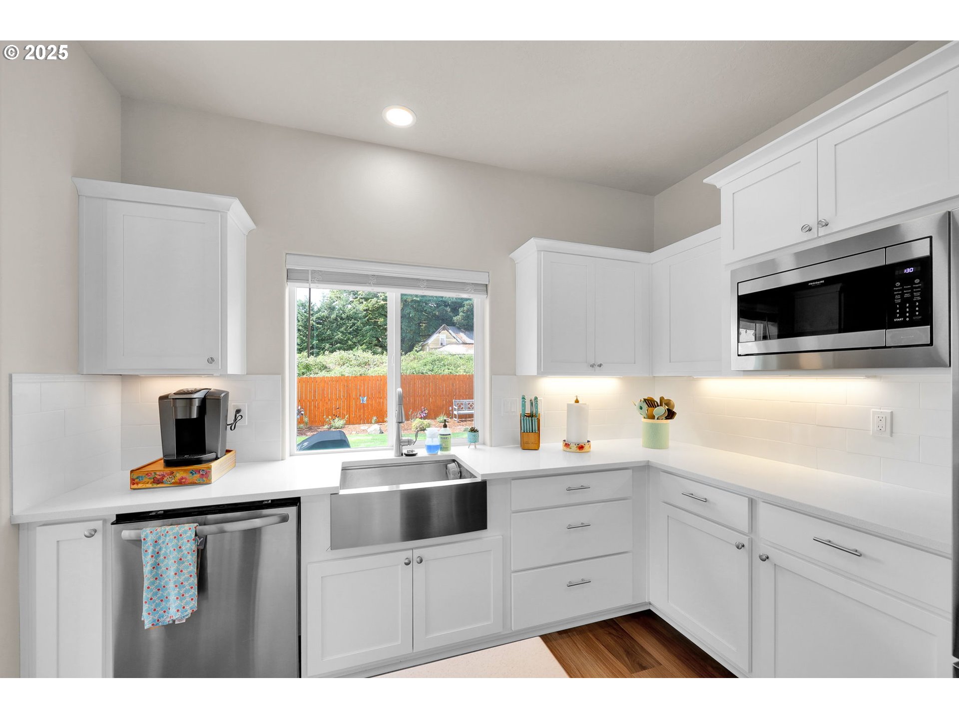 580 South 10th Street Monroe, OR 97456 - Photo 14 of 45 a kitchen with white cabinets a sink and white appliances