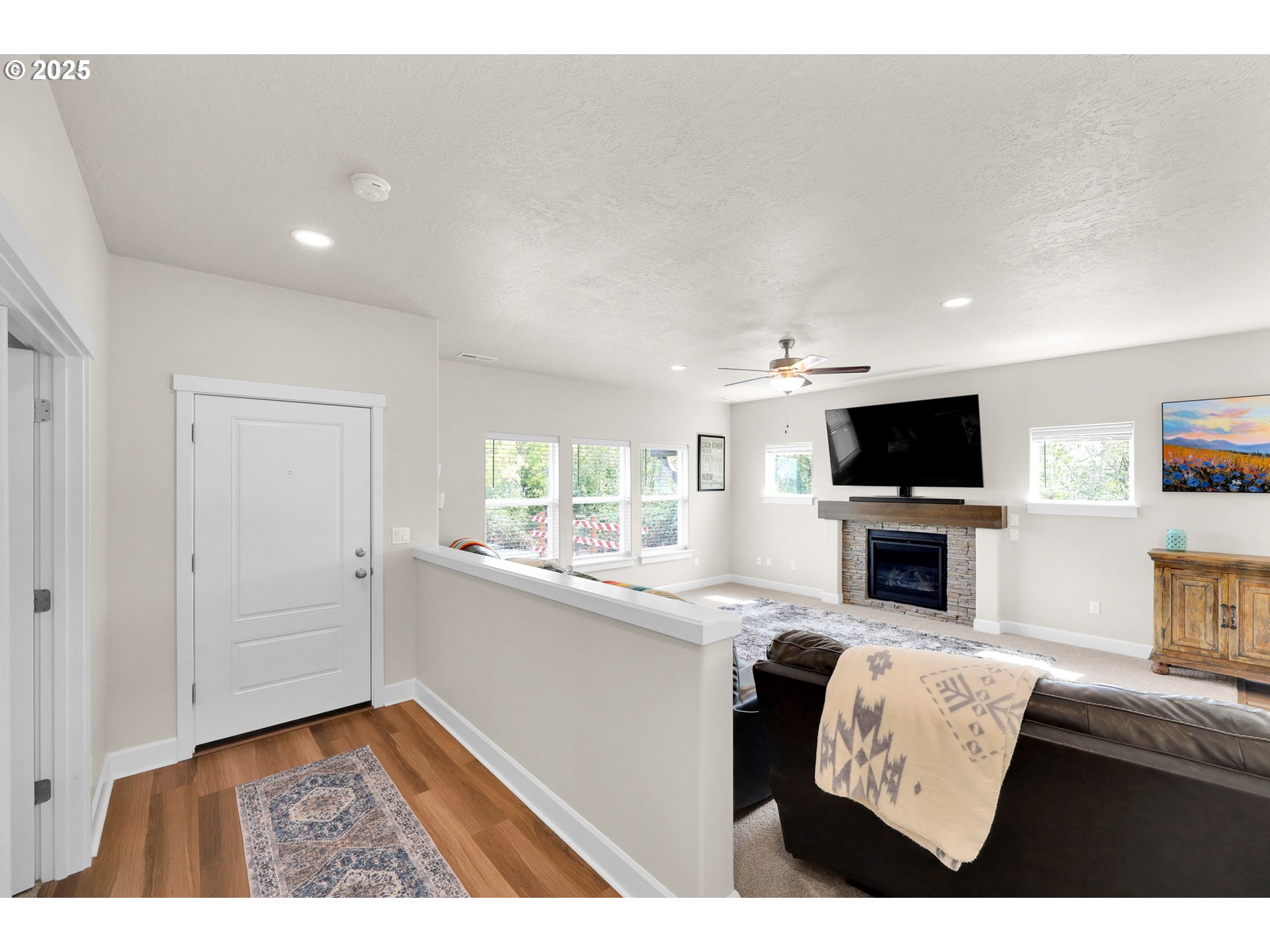 580 South 10th Street Monroe, OR 97456 - Photo 21 of 45 a view of living room kitchen with furniture and flat screen tv