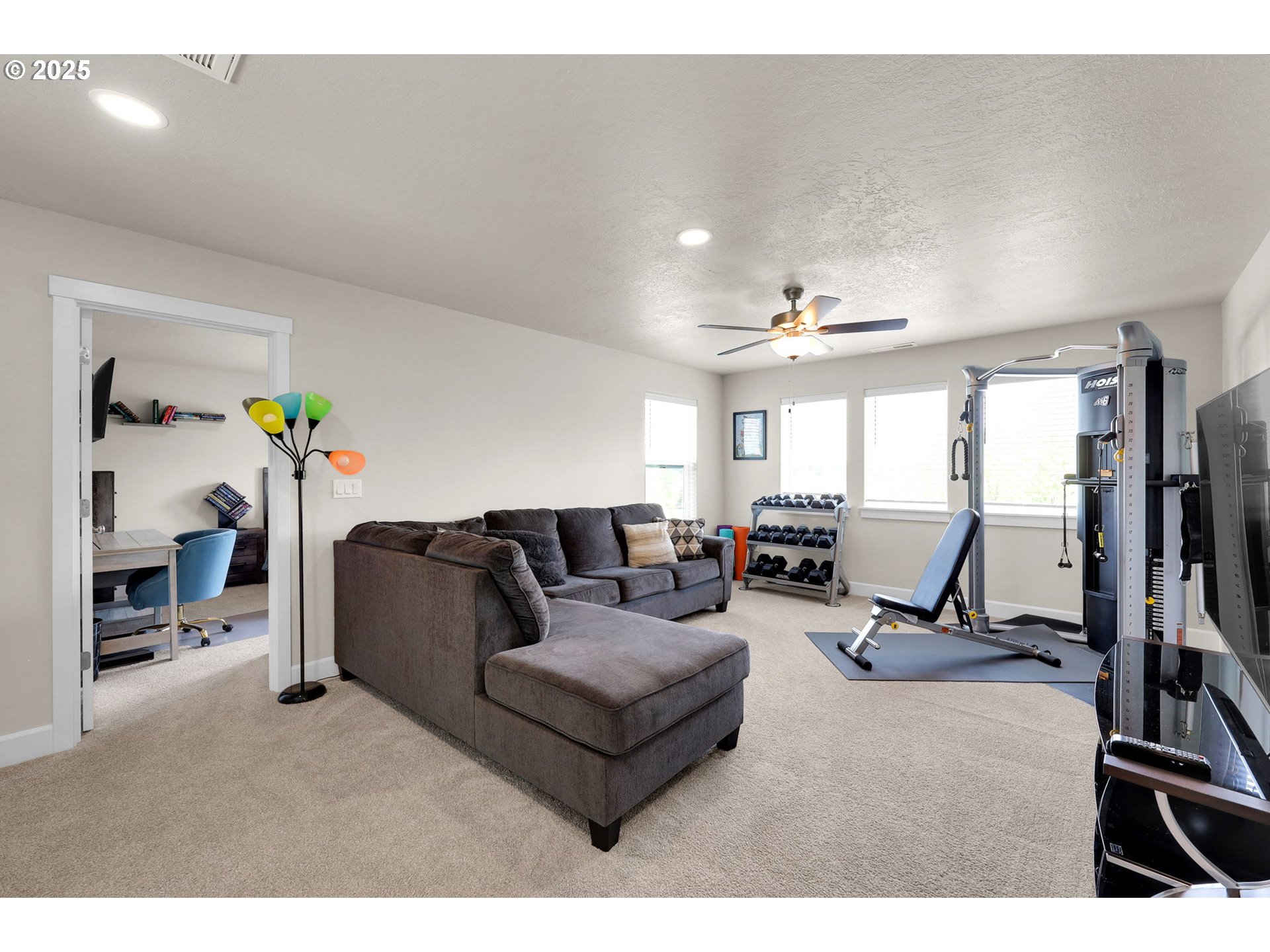 580 South 10th Street Monroe, OR 97456 - Photo 22 of 45 a living room with furniture and a flat screen tv