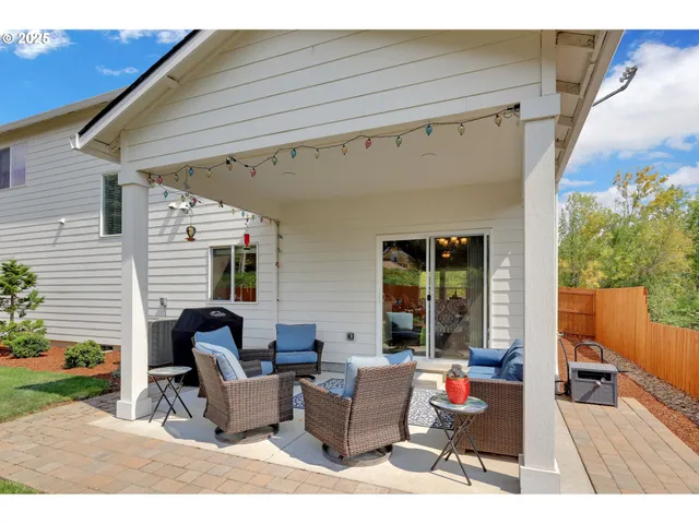 a outdoor space with patio the couches and a dining table with the potted plant