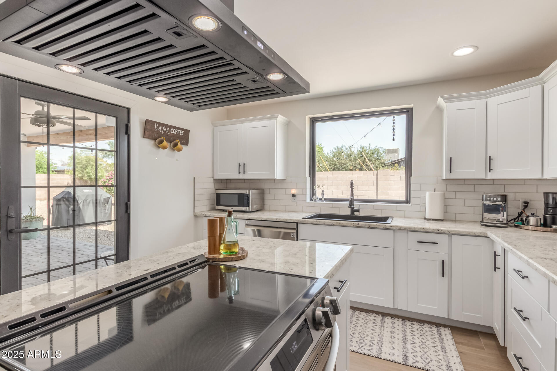 226 East McKinley Street Tempe, AZ 85288 - Photo 11 of 36 a kitchen with a sink appliances cabinets and a large window