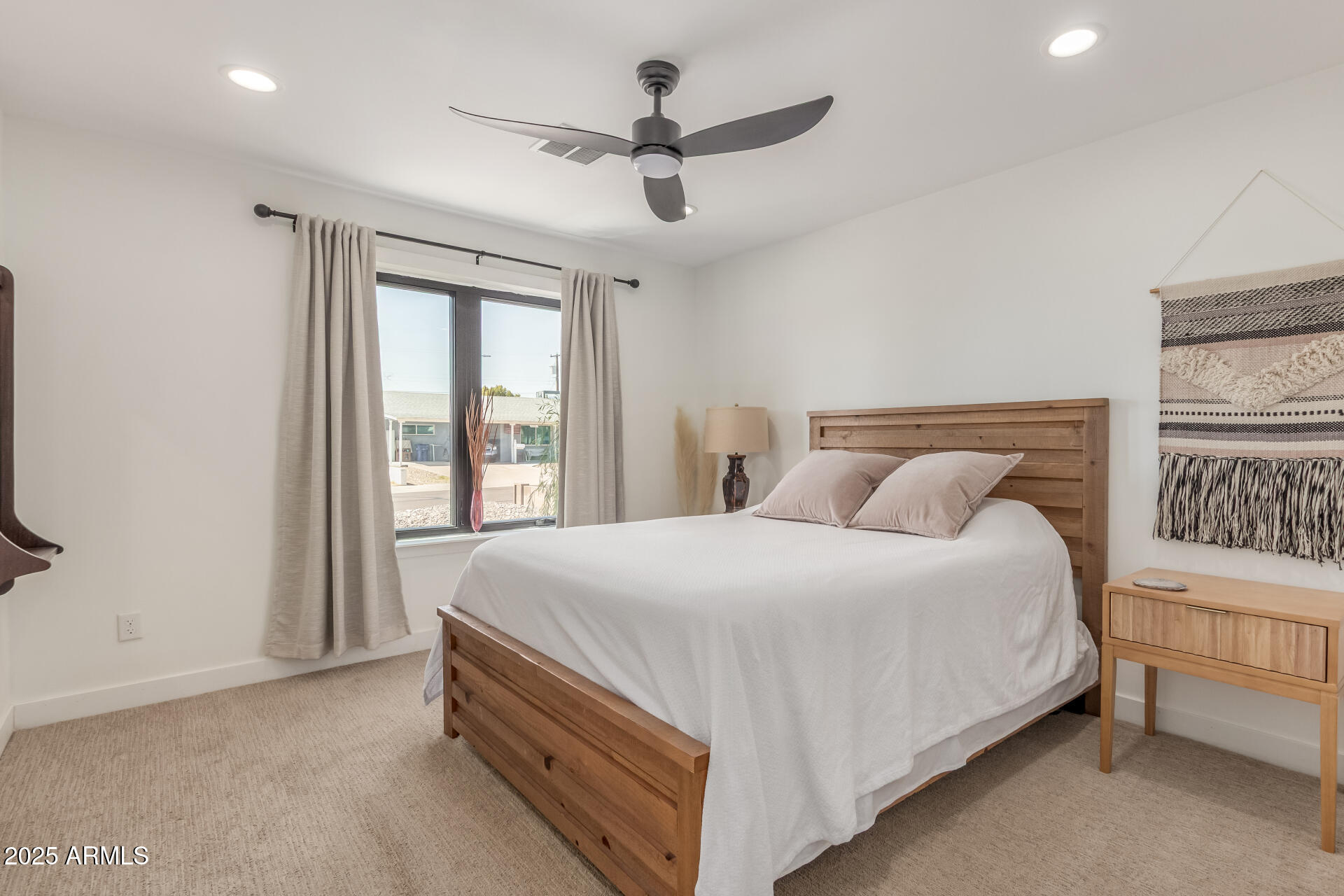 226 East McKinley Street Tempe, AZ 85288 - Photo 20 of 36 a large bed sitting in a bedroom next to a window
