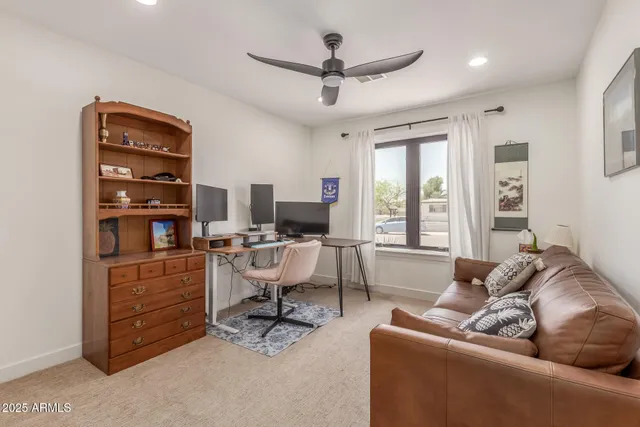 a large bed in a white room