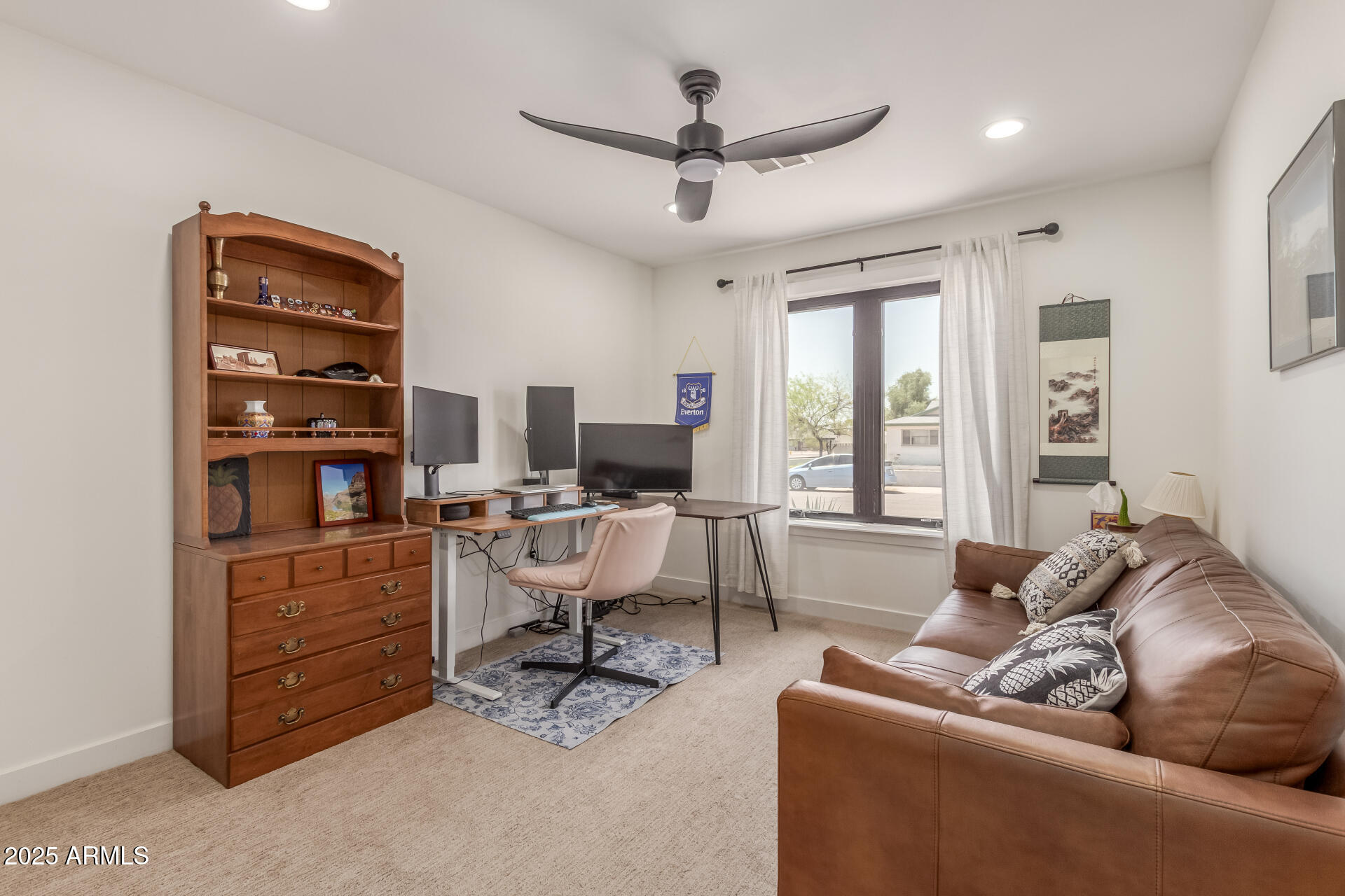 226 East McKinley Street Tempe, AZ 85288 - Photo 21 of 36 a living room with furniture a ceiling fan and a window