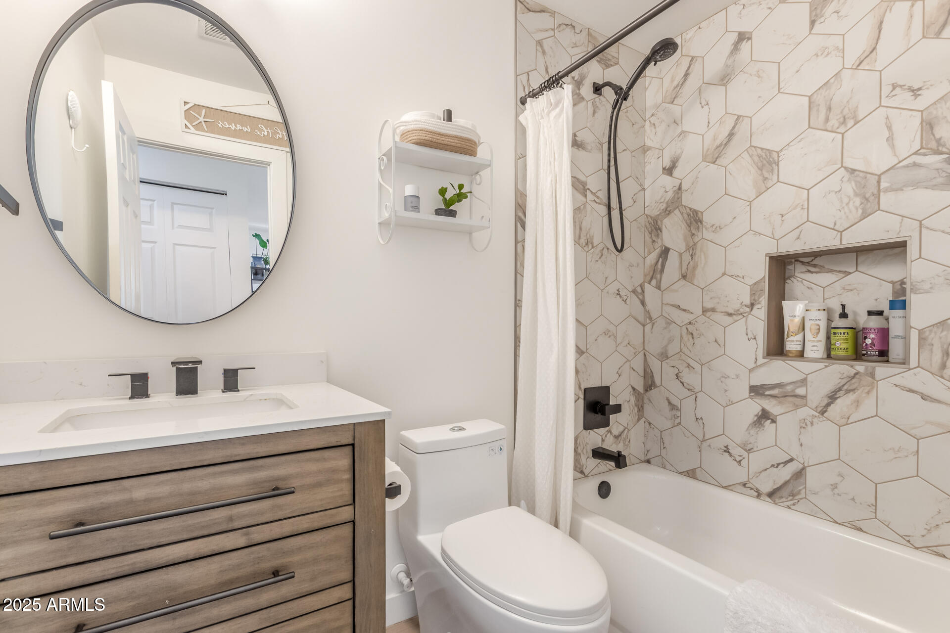 226 East McKinley Street Tempe, AZ 85288 - Photo 23 of 36 a bathroom with a sink a toilet and a mirror