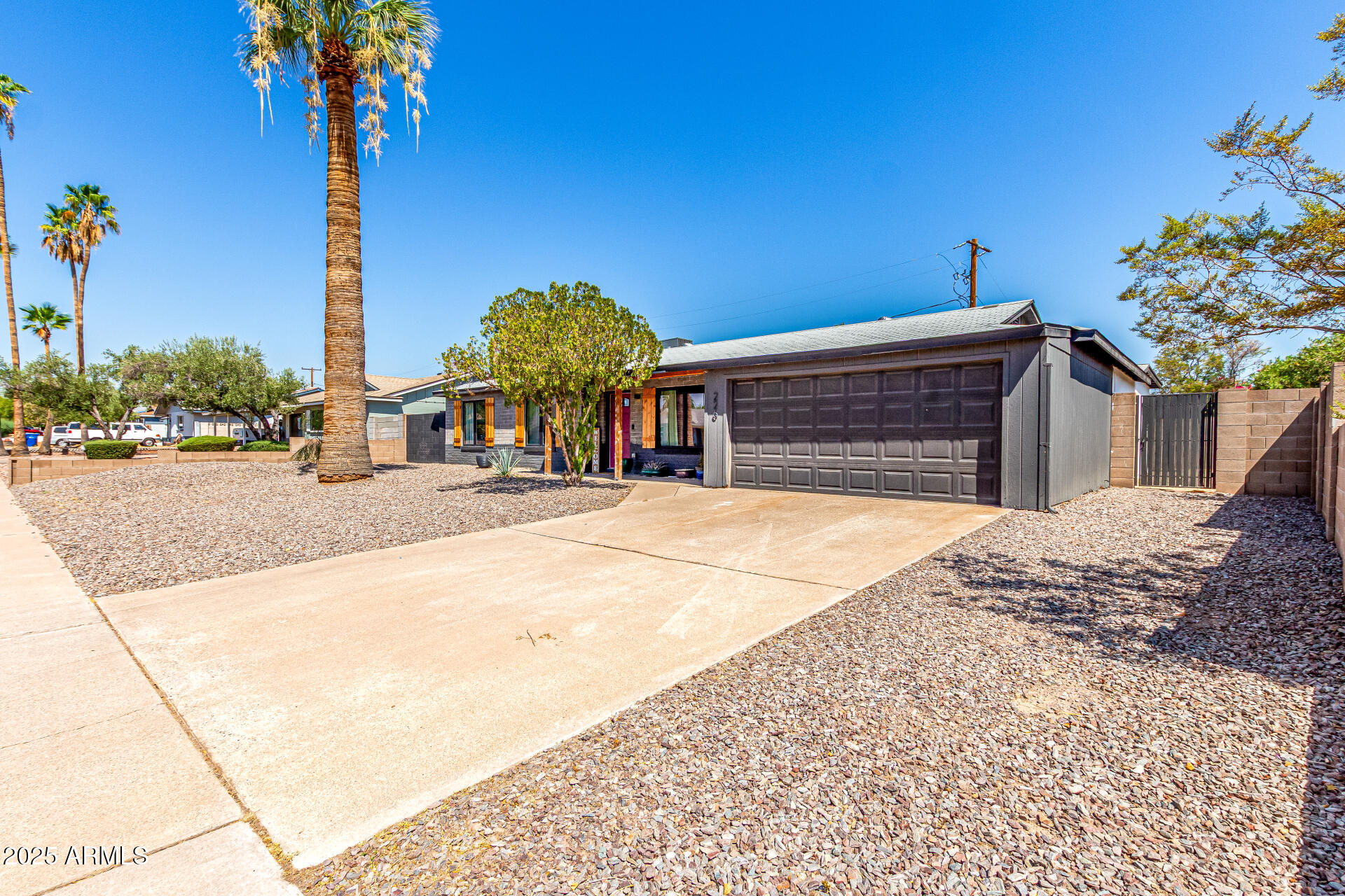 226 East McKinley Street Tempe, AZ 85288 - Photo 33 of 36 a view of a house with palm trees