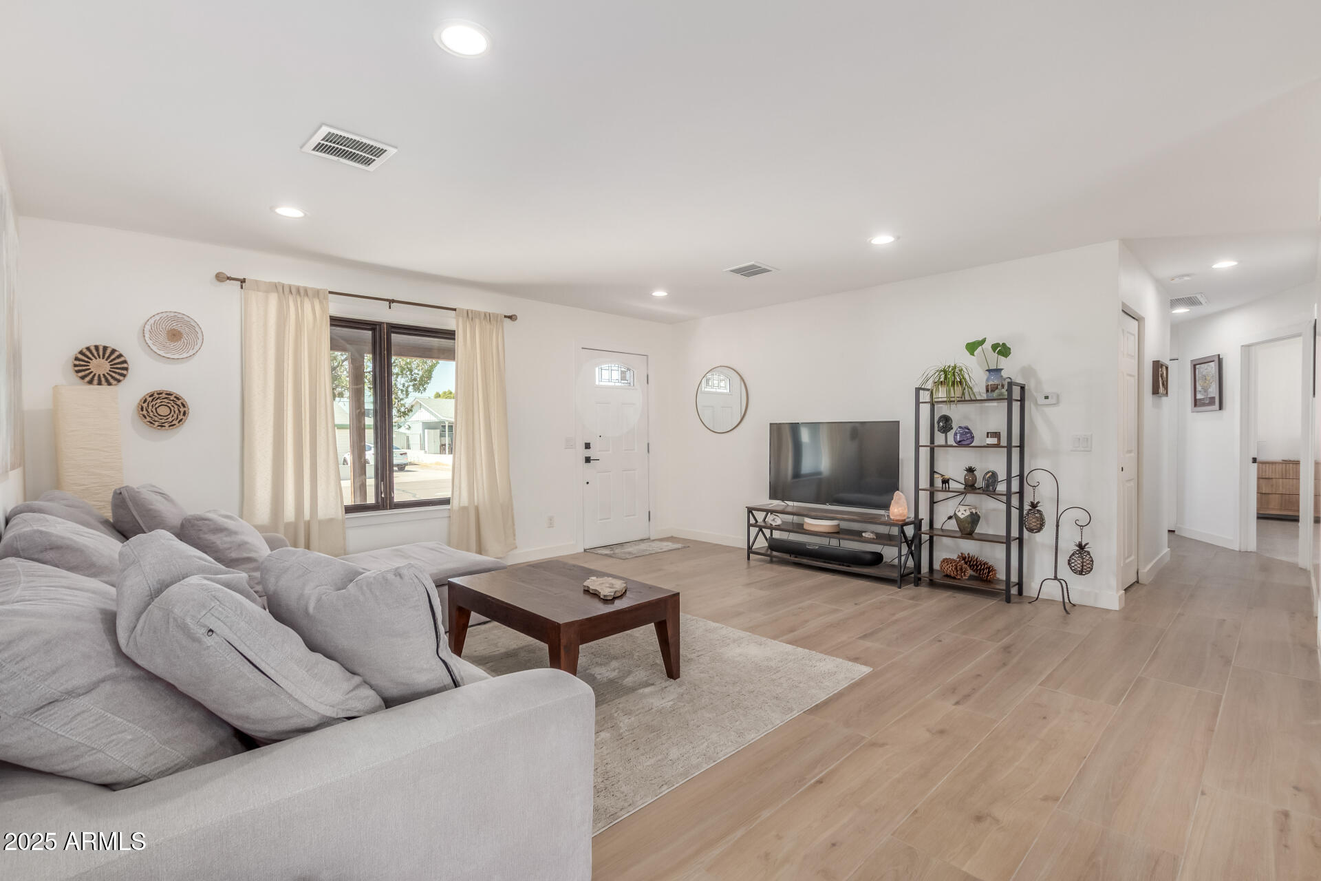 226 East McKinley Street Tempe, AZ 85288 - Photo 4 of 36 a living room with furniture and a flat screen tv