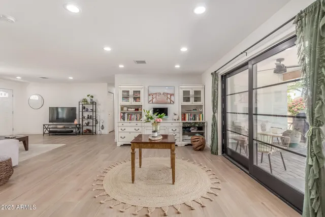 a living room with furniture and a table