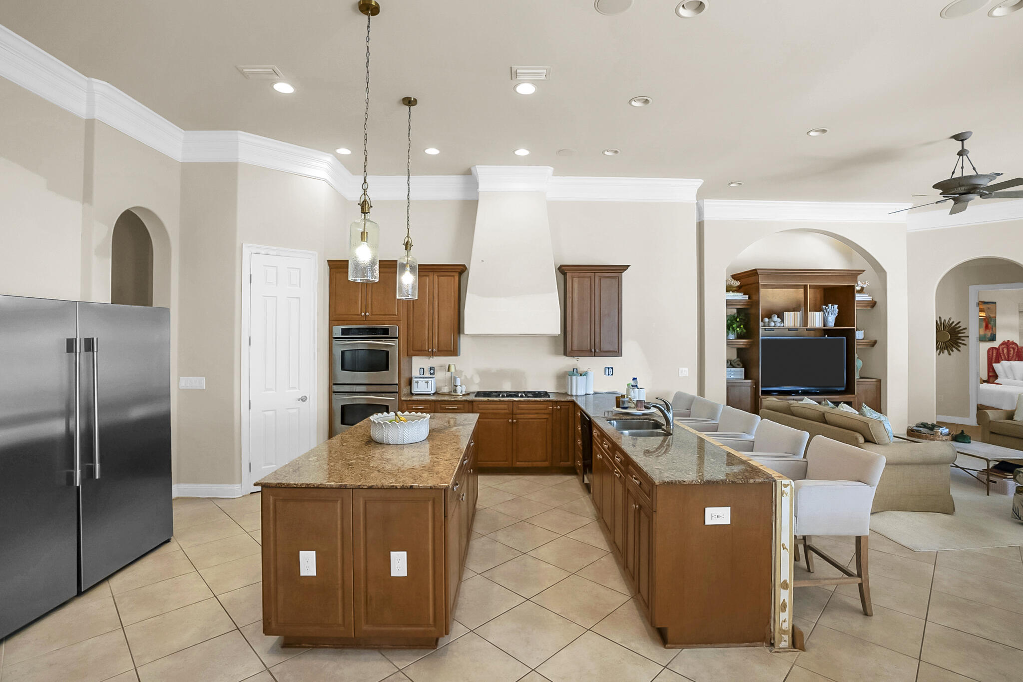 4372 Stonebridge Road Destin, FL 32541 - Photo 13 of 83 a large kitchen with kitchen island a counter top space a sink stainless steel appliances and cabinets
