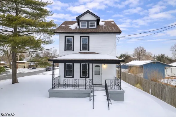 a front view of a house with a porch