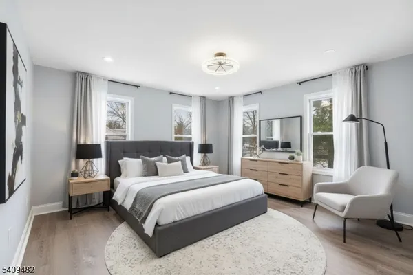 a view of an entryway with wooden floor