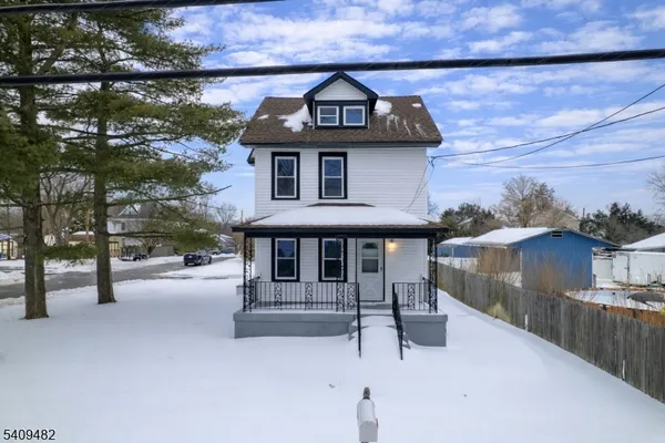 a view of a house with a street