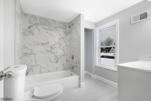 a bathroom with a sink a vanity and a mirror