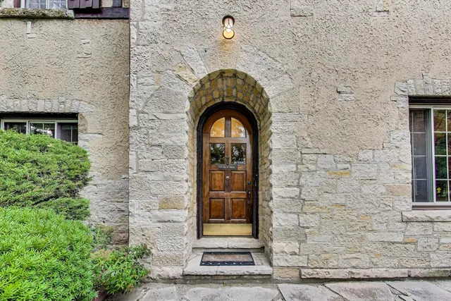 a view of a stone house with a door
